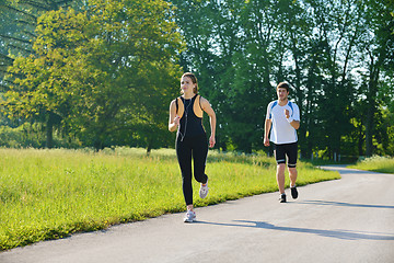 Image showing Young couple jogging at morning