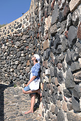 Image showing Greek woman on the streets of Oia, Santorini, Greece