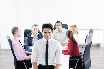 Image showing young business man at meeting