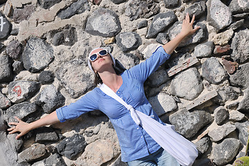 Image showing Greek woman on the streets of Oia, Santorini, Greece