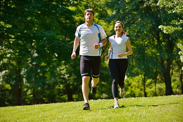 Image showing Young couple jogging