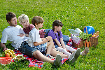 Image showing Happy family playing together in a picnic outdoors