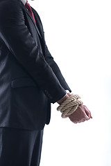 Image showing business man with rope isolated on white background