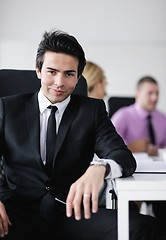 Image showing young business man at meeting