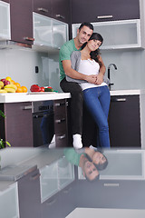 Image showing young couple have fun in modern kitchen