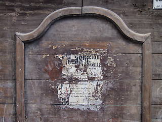 Image showing Old poster on wooden wall