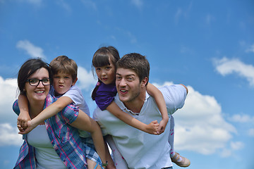 Image showing happy young family have fun outdoors