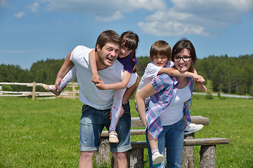 Image showing happy young family have fun outdoors