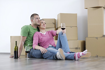 Image showing Young couple moving in new home