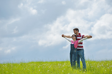 Image showing Portrait of romantic young couple smiling together outdoor