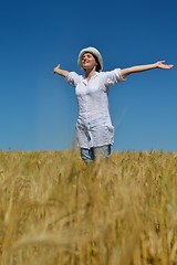 Image showing young woman in wheat field at summer