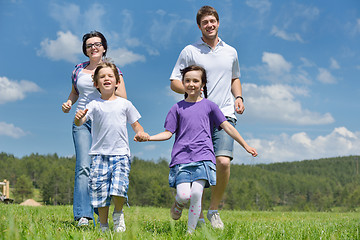 Image showing happy young family have fun outdoors