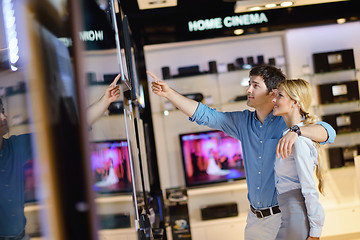 Image showing Young couple in consumer electronics store