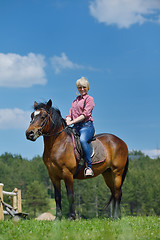 Image showing happy woman  on  horse