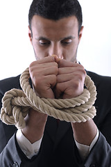 Image showing business man with rope isolated on white background