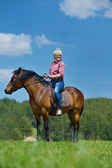 Image showing happy woman  on  horse