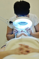Image showing woman with facial mask in cosmetic studio