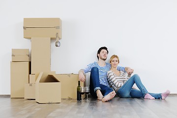 Image showing Young couple moving in new house