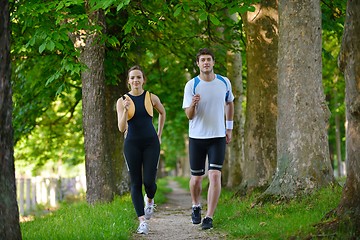 Image showing Young couple jogging