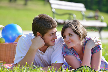 Image showing happy young couple having a picnic outdoor