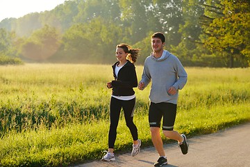 Image showing Young couple jogging