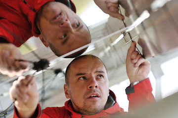 Image showing Male solar panel engineer at work place