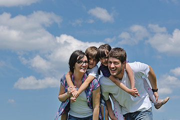 Image showing happy young family have fun outdoors