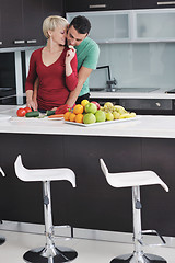 Image showing young couple have fun in modern kitchen