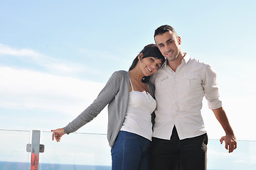 Image showing couple relaxing on balcony