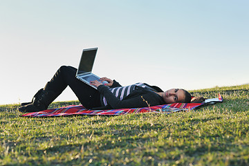 Image showing young teen girl work on laptop outdoor