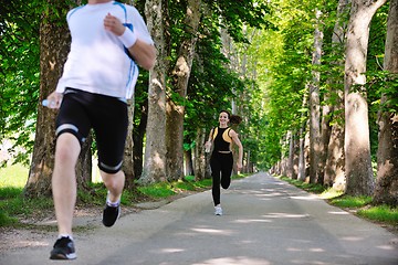 Image showing Young couple jogging