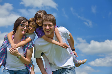 Image showing happy young family have fun outdoors