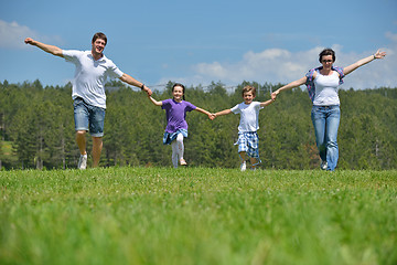 Image showing happy young family have fun outdoors