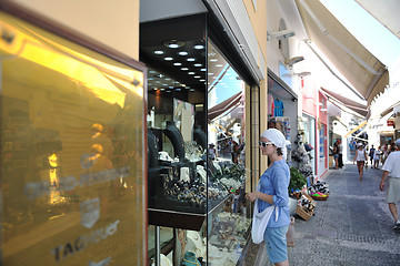 Image showing Greek woman on the streets of Oia, Santorini, Greece