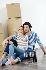 Image showing Young couple moving in new house