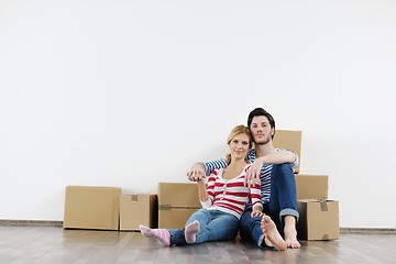 Image showing Young couple moving in new house