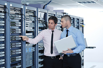 Image showing it enineers in network server room