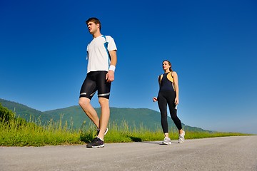 Image showing Young couple jogging