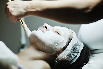 Image showing woman with facial mask in cosmetic studio