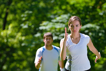 Image showing Young couple jogging at morning