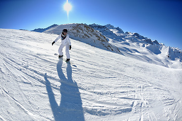 Image showing skiing on fresh snow at winter season at beautiful sunny day