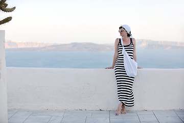 Image showing Greek woman on the streets of Oia, Santorini, Greece