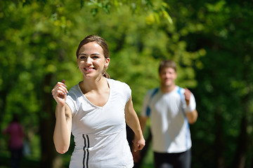 Image showing Young couple jogging at morning