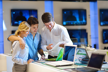 Image showing Young couple in consumer electronics store