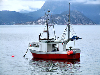 Image showing Fishing boat on anchor in haven