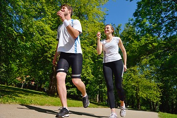 Image showing Young couple jogging