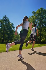 Image showing Young couple jogging at morning