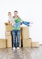 Image showing Young couple moving in new house