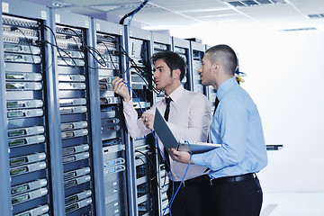 Image showing it enineers in network server room