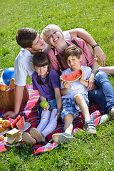 Image showing Happy family playing together in a picnic outdoors